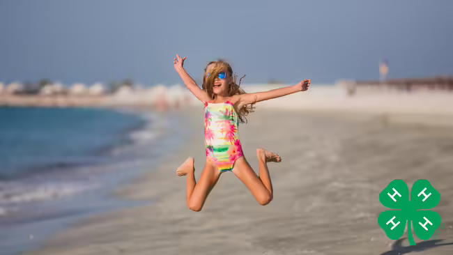 Girl jumping on the beach