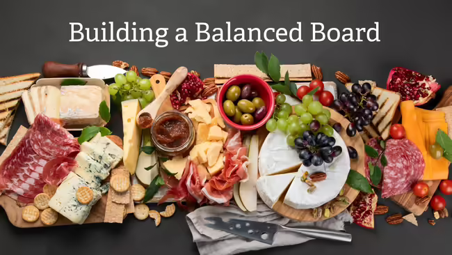 a healthy charcuterie board with meats, cheeses, and fruits