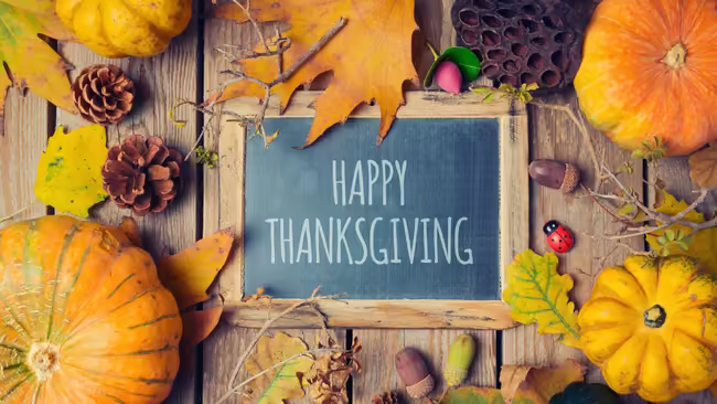 Happy Thanksgiving with pumpkins and leaves