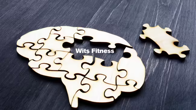 A brain-shaped jigsaw puzzle with two pieces missing.