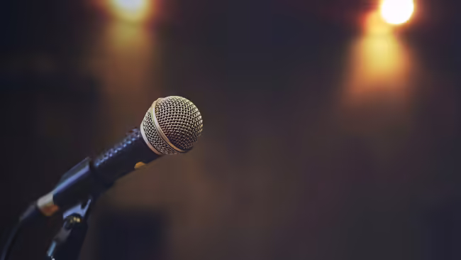 Close up of microphone on stage lighting 