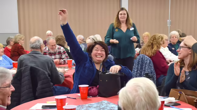 Sarah Smith raising her hand
