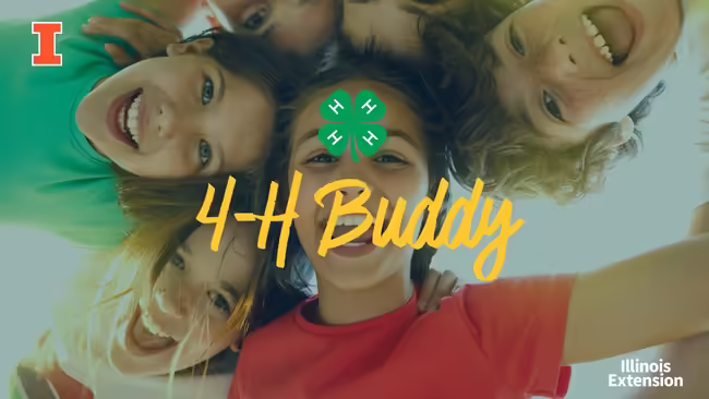 A group of kids standing in a circle with their heads touching looking at the same object from above.