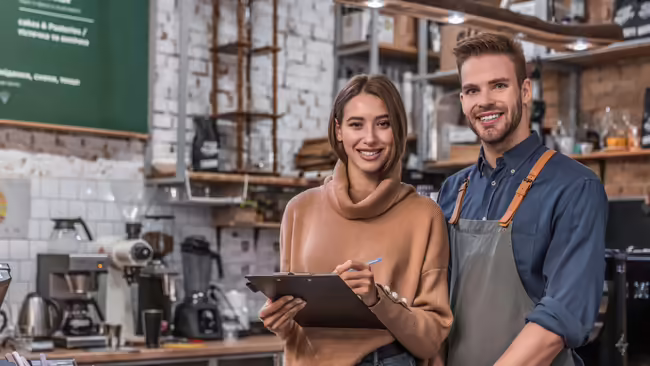 stock photo of a man and woman working in a small business