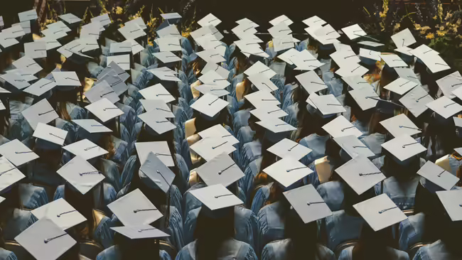 group of people wearing graduation caps