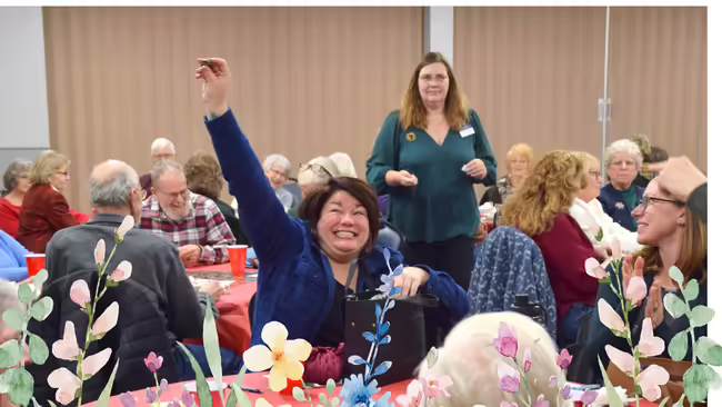 Sarah Smith with arm up in the air