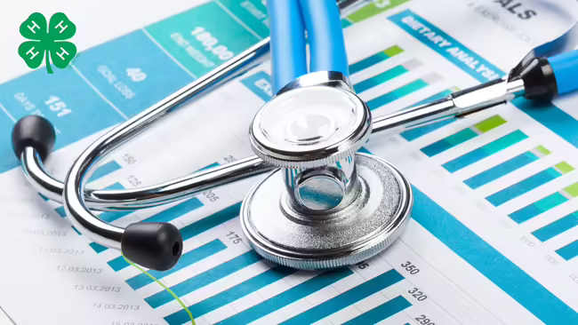 A stethoscope resting on top of medical charts and bar graphs featuring a green 4-H logo in the upper left corner.