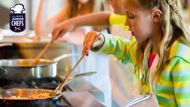 A child cooking at a stovetop, with a logo for "Illinois Junior Chefs" in the top left corner.
