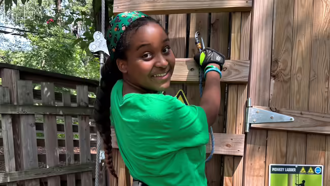 Summer camper enjoying Go Ape Zipline and Adventure Park event
