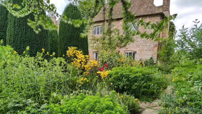 brick house with green garden