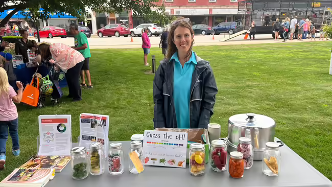 Kristin Bogdonas at a nutrition table at a past Farm in the Park
