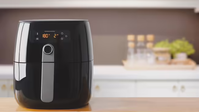 Air fryer machine on a kitchen counter.