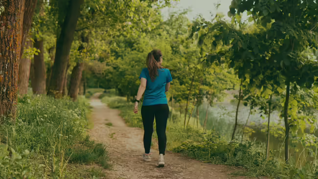 woman walking in forest