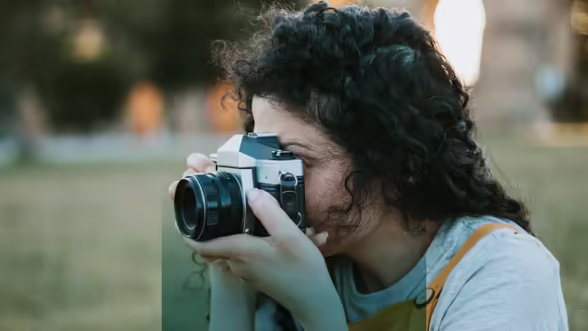 person taking picture with camera