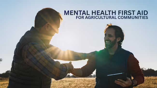 Two farmers shaking hands in cultivated field at sunset, making business agreement