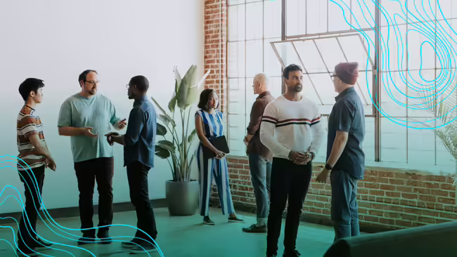 group of people standing around talking