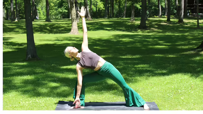 Woman doing a yoga pose outside.