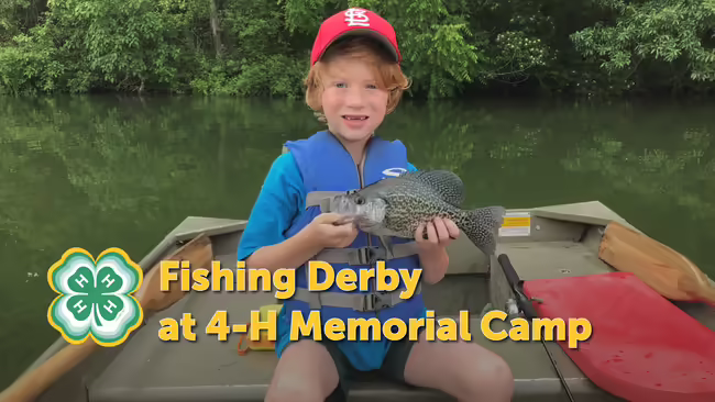 Boy holding a fish