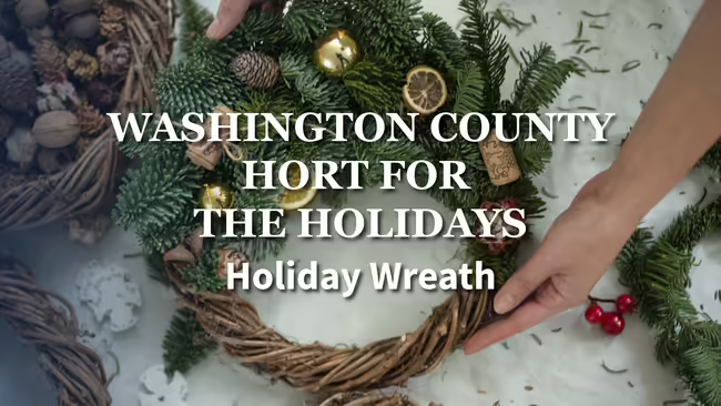 hands holding a wreath