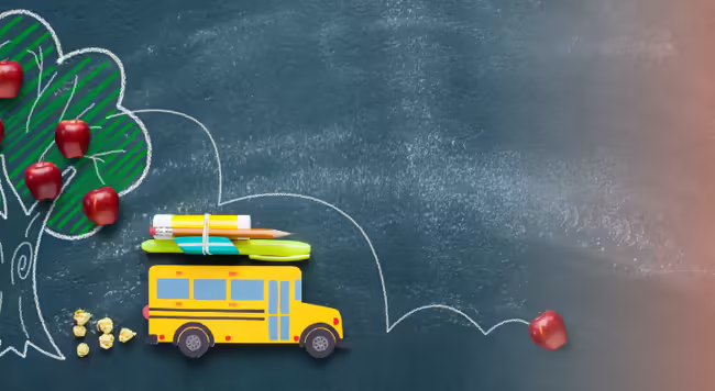 a school bus driving away from an apple tree