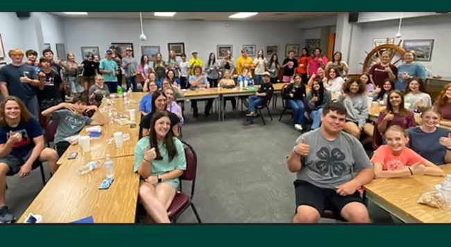 teen teachers pose and smile