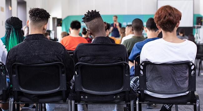 teenagers sitting in classroom