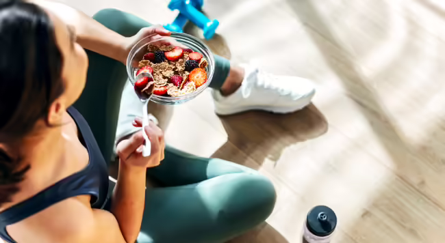 girl sitting eating yogurt