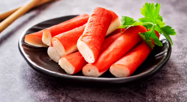 sticks of imitation crab on a plate
