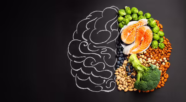 A drawing of a brain with a variety of food representing half of it.