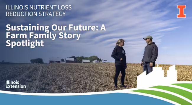 Farmers standing in harvested corn field