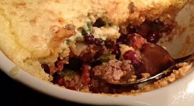 Beef and bean casserole under cornbread