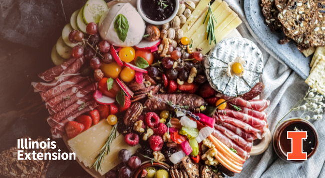 Array of fruits, meats, nuts, and cheese on a charcuterie board