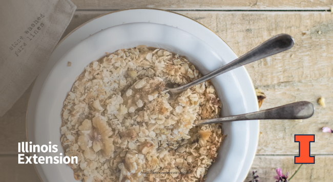 Oatmeal in a white bowl with two spoons 