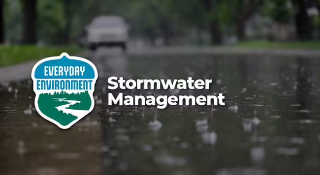 picture of a street with rain drops and text overlay stormwater management