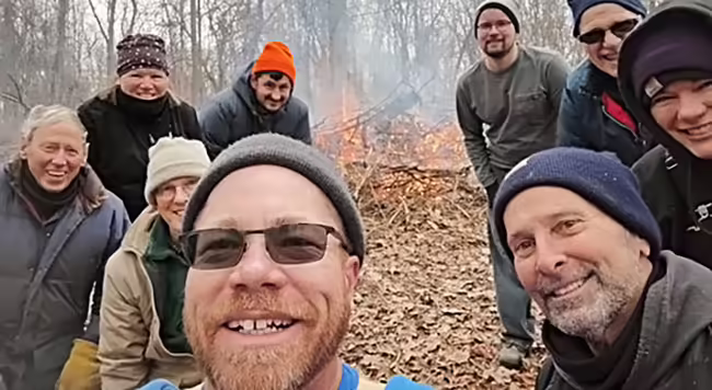 group burning brush in the woods