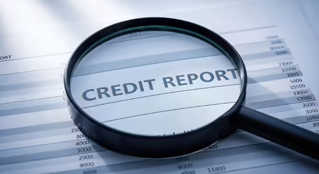 Credit report with magnifying glass