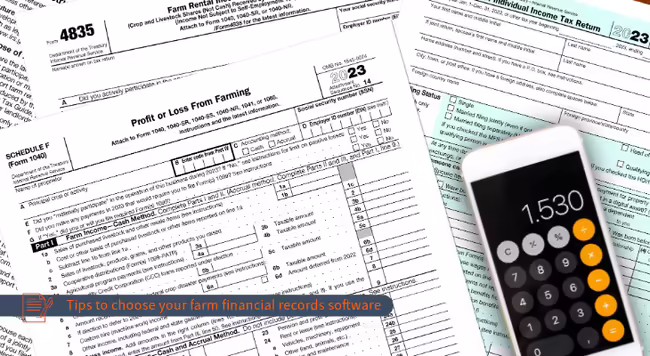 a calculator sitting on top of various farm-related tax forms
