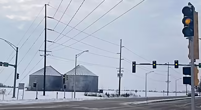 Picture of grain bins near a rural road