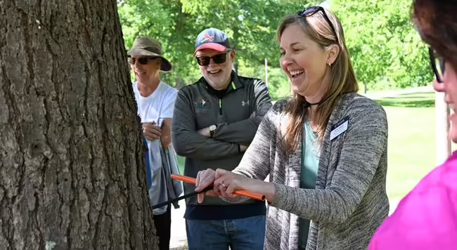 Karen Weigelt using forestry tool