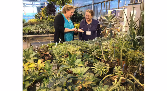 Parkland College Horticulture Instructor, Theresa Meers, teaches Master Gardener Trainee, Margaret Briskin, about succulents at tour of the Parkland greenhouses during the 2019 Master Gardner Training Course.