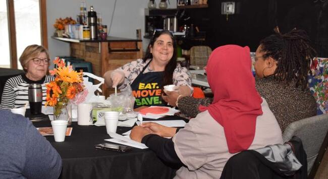 Community worker engages clients in discussion on nutrition lesson