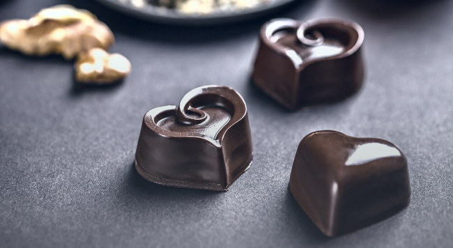 Image of heart-shaped chocolates next to gold foil