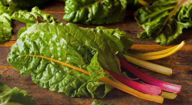 Swiss chard on wood table