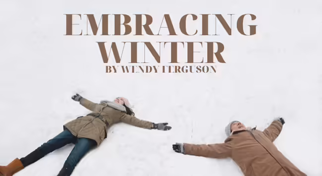 woman and man making snow angels