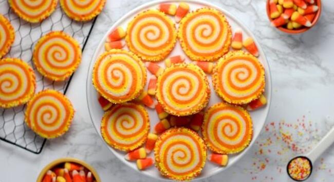 Orange and yellow candy corn swirled cakes