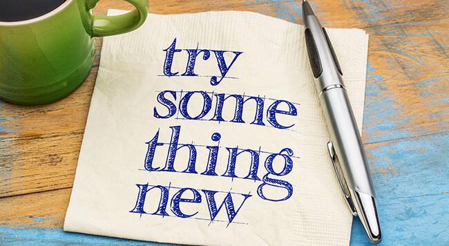 a paper that says "try something new" 