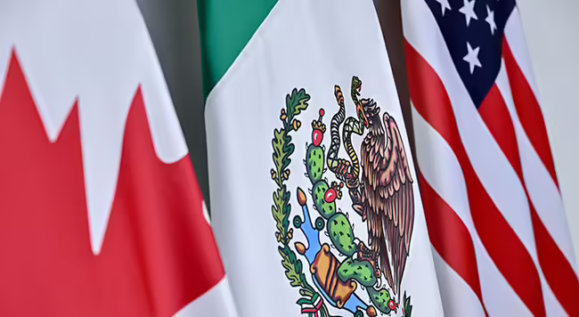 The flags of Canada, Mexico, and the United States.