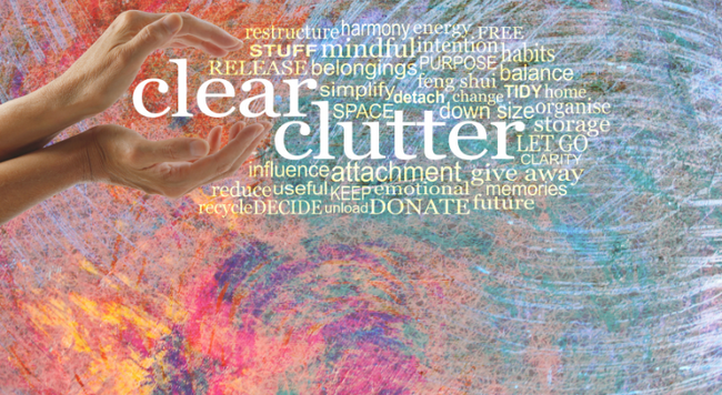hands that appear to be holding the word clear clutter with smaller words surrounding