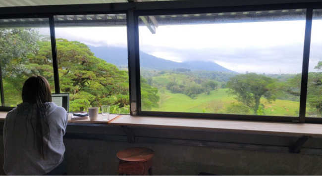 student looking out the window in Costa Rica