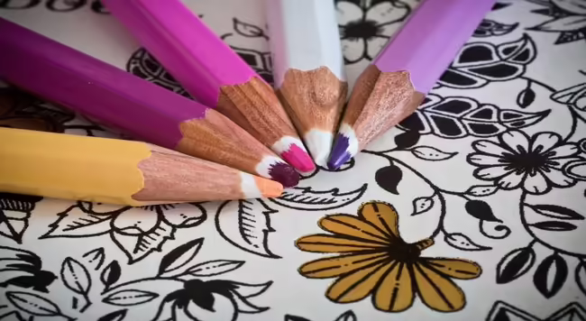 colored pencils and book
